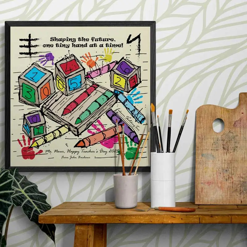 Framed artwork with colorful hand-drawn elements on a wall above a wooden shelf.