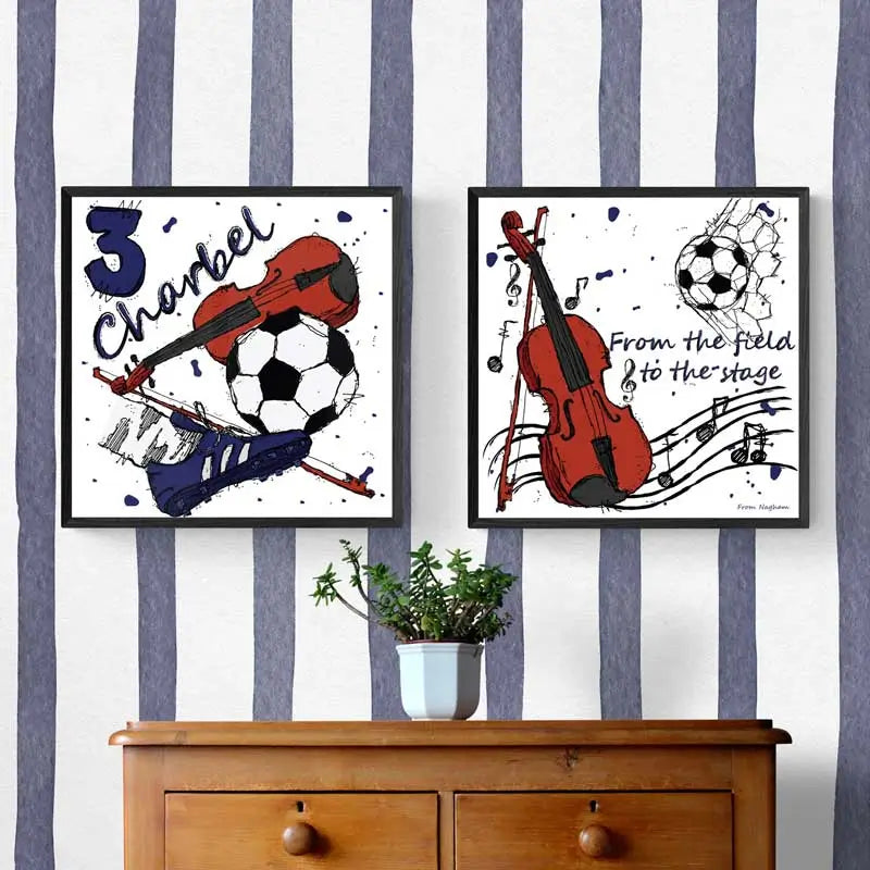 Two framed artworks with sports and music theme on a striped wall above a wooden cabinet. Customized wall posters for a little boy.