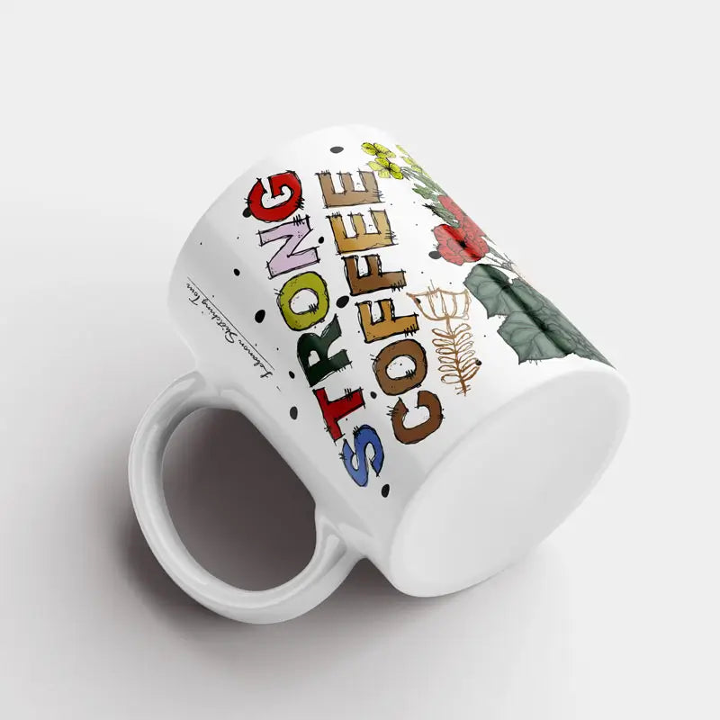 A floral Lebanese mug with the words, strong coffee, strong woman in colorful way
