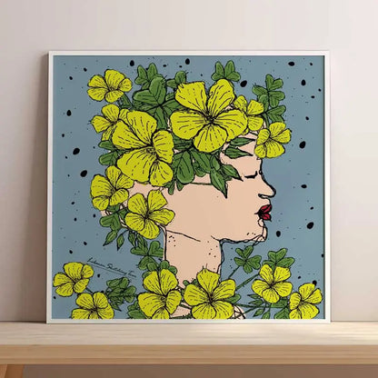 Framed artwork of a woman's profile with yellow flowers and green leaves on a blue background. Lebanese flowers poster, Lebanese poster